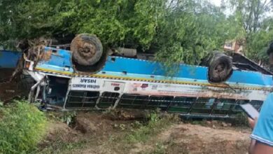 Passenger bus overturns while trying to save Scooty, 12 people injured