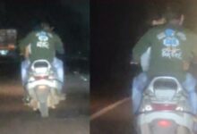 Couple Romance Video: चलती स्कूटी पर रोमांस करता कपल का वीडियो वायरल, लोगों में आक्रोश...